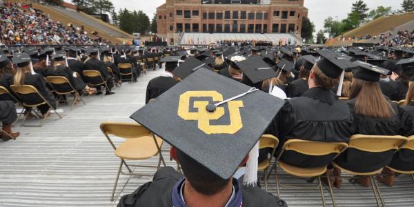 cu on student's graduation cap