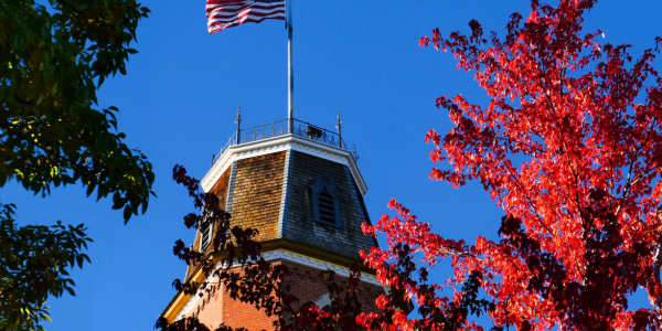 Image of CU Boulder Campus with American Flag for Veteran's Day