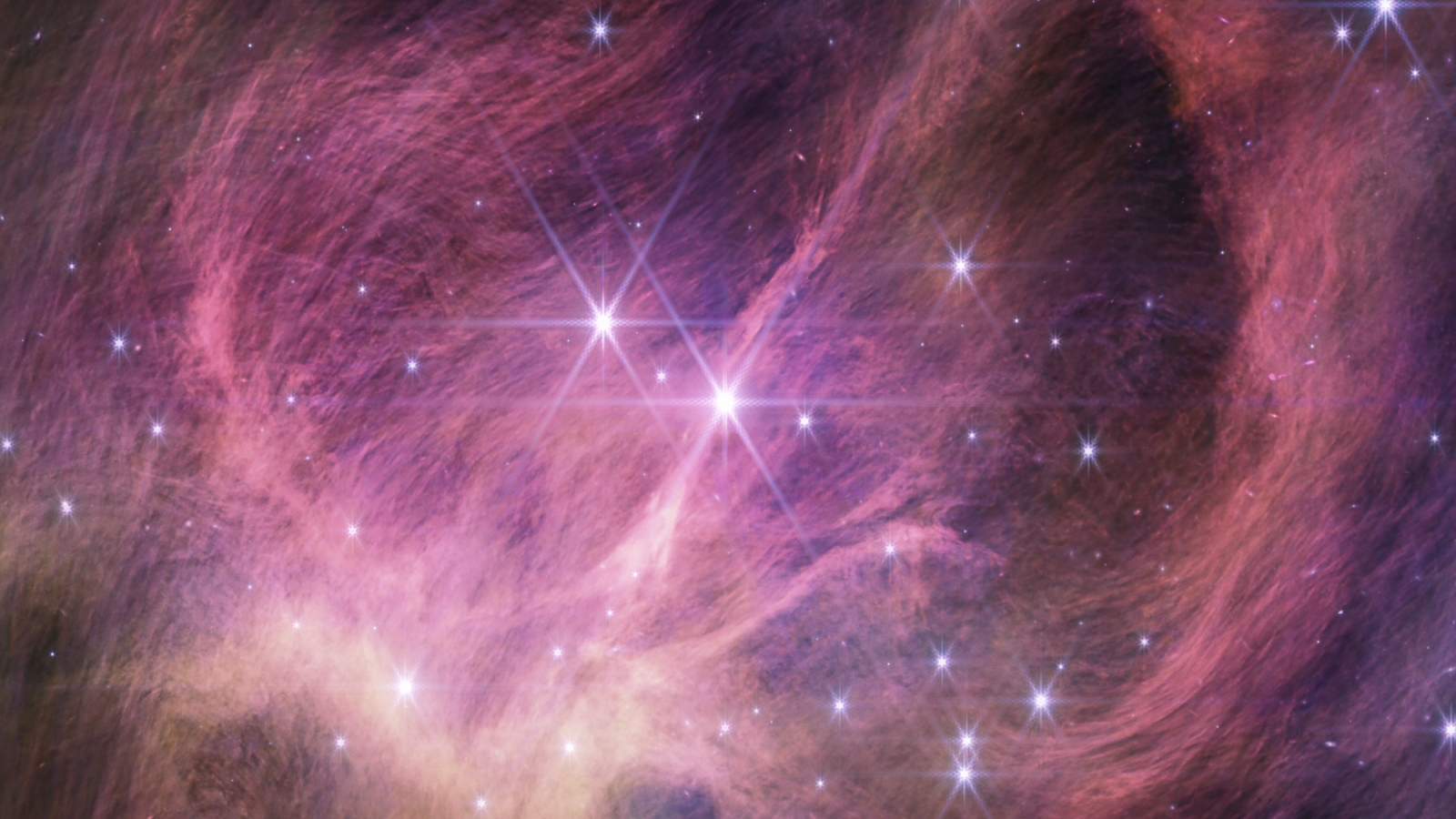 Pink and Gold nebulous Image from the NASA James Webb Space Telescope