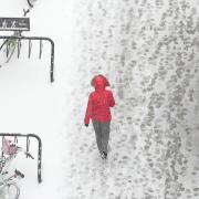 Student walking in the snow