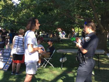 An officer takes a report from a student on the CU Boulder campus