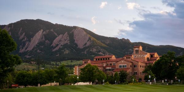 Kobel Building at sunset with the Flatirons in the background.