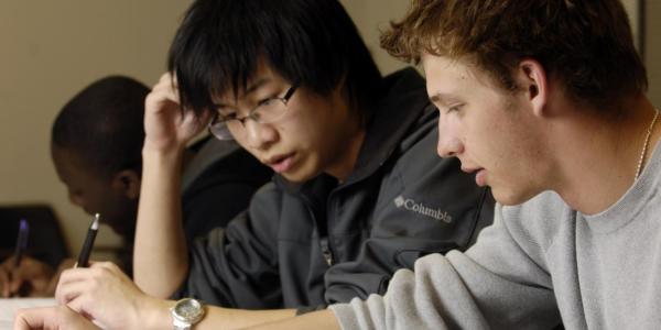 Two students work together on an assignment