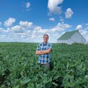 Brian DeDecker in a soybean field at his family farm in Illinois.