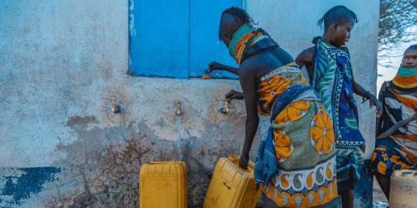 People gathering water in urban Africa