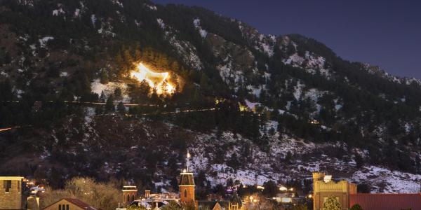 The Boulder star light on the foothills beyond the CU Boulder campus