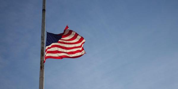 American flag flying half mast