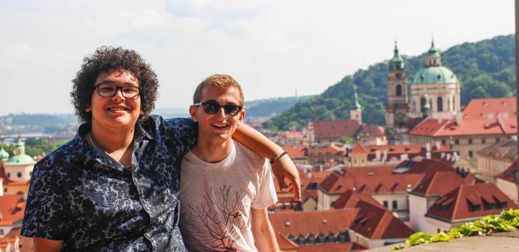 Two students in front of the Prague, Czech Republic, cityscape