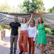 Professors Shawhin Roudbari, Chelsea Hackett, Rebecca Safran and Beth Osnes pictured with a giant bird puppet