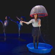  Dance performance, woman under umbrella