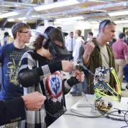 Person wears virtual reality goggles as part of engineering expo project
