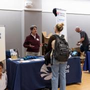 Student visiting a booth at the Just in Time career fair