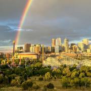 A double rainbow appears over Elitch Gardens in Denver. (Photo by Steph Wilson on Unsplash)