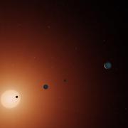 Illustration of five planets with a star in the background