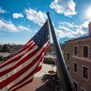 U.S. flag flies in front of the UMC